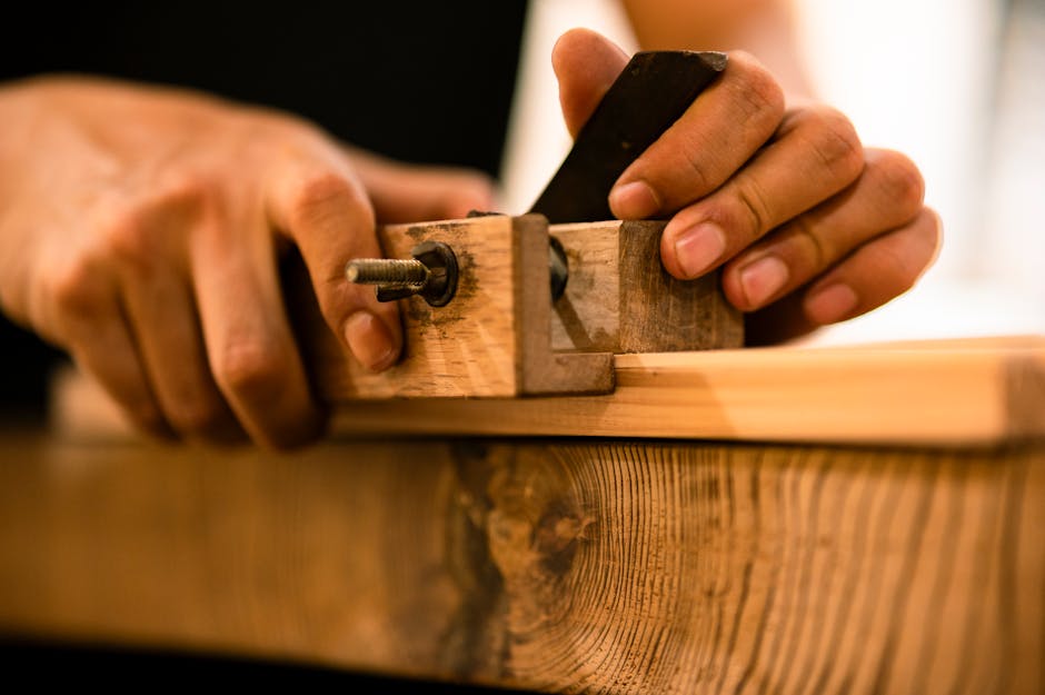 Master carpenter working on custom wood kitchen cabinets